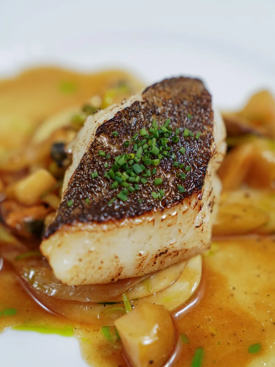 Turbot with a crisp browned skin and chives, in a buttery sauce with turnip